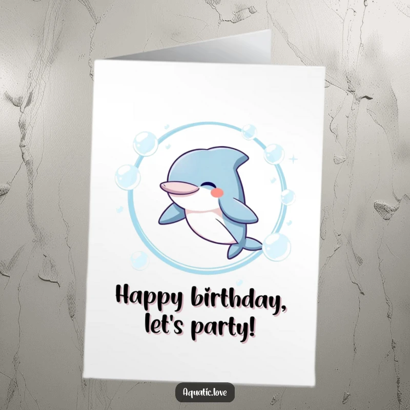 Free Printable Birthday Card: A giggling dolphin joyfully leaps through a hoop made of sparkling bubbles, celebrating big.