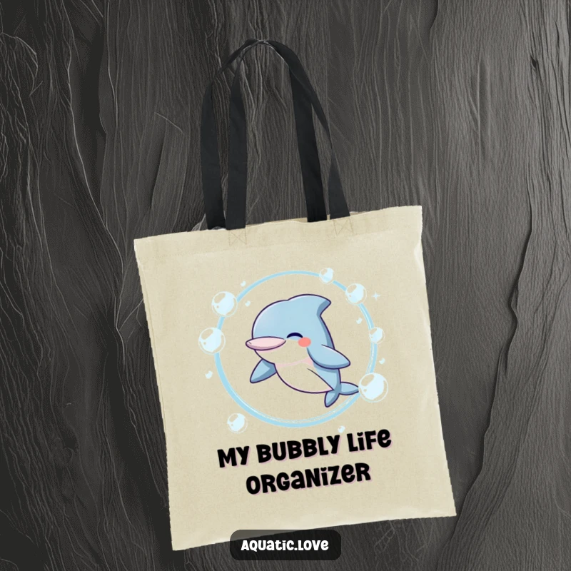 Funny Tote Bag featuring a giggling dolphin character joyfully jumping through a ring of bubbles, ready for errands and adventures.